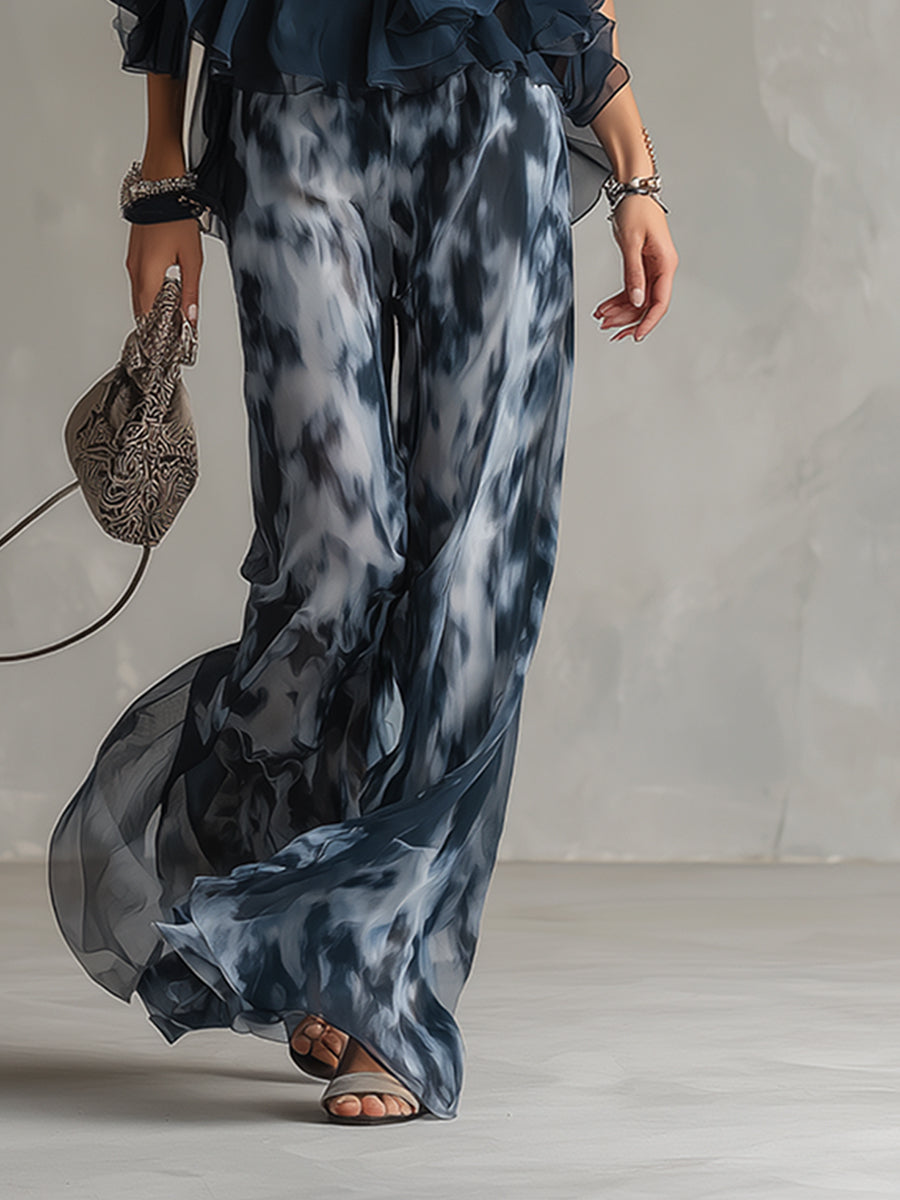 Luisa - Elegant chiffon dress with a high-necked top and wide-cut, patterned trousers.
